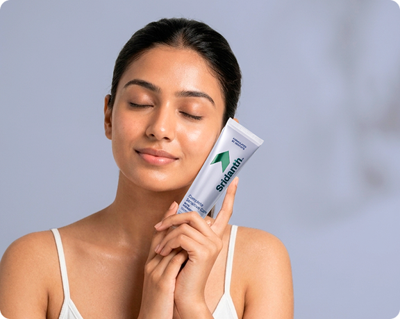 Smiling woman holding product